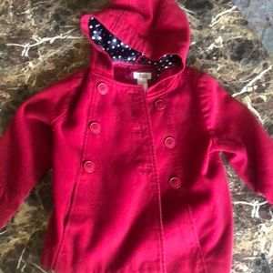 Red polyester kids jacket. Double button with silk lining